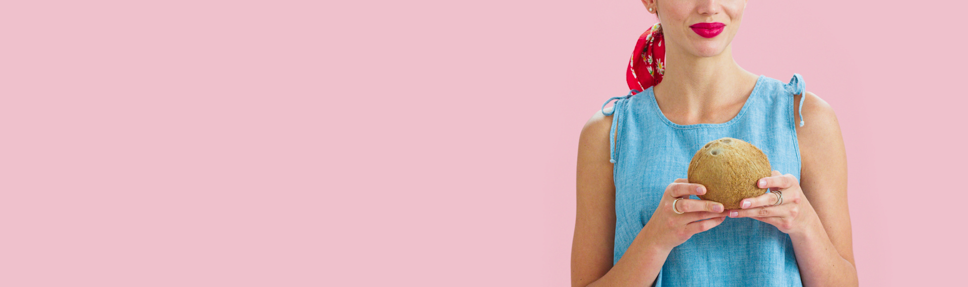 Woman holding a coconut