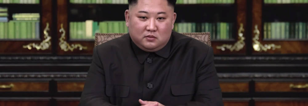Deep fake of Kim Jong-un sitting at a desk