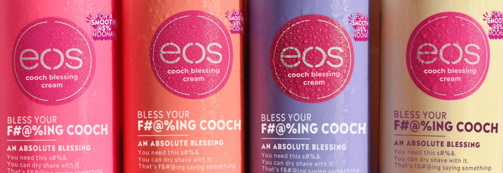 4 eos shaving cream products lined up in a shower organizer
