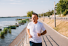 man running outside along a lake