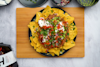 huel mexican chili nachos on a plate on a wooden board