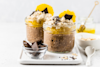 Chocolate protein orange slices overnight oats in glasses.