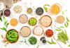 Legumes, beans and sprouts. Dried, raw and fresh, top view. Red beans, lentils, mung beans, chickpeas, soybeans, edamame, green peas, Healthy diet food, vegan protein, micronutrients fiber sources