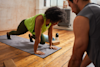 woman doing mountain climbers on a yoga mat