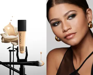 Näyttelijä Zendaya katsoo sivulle ja hänen vieressään on Lancômen Teint Idole meikkivoide.