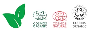 Cosmos-logot: Cosmos Organic, Cosmos Natural ja Cosmos Soil Association Organic.