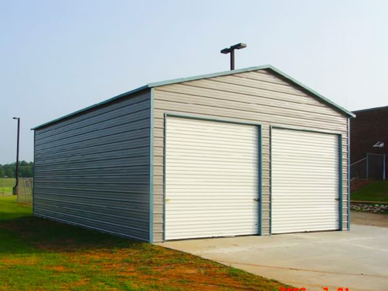 Two-tone steel garage with roll-up doors