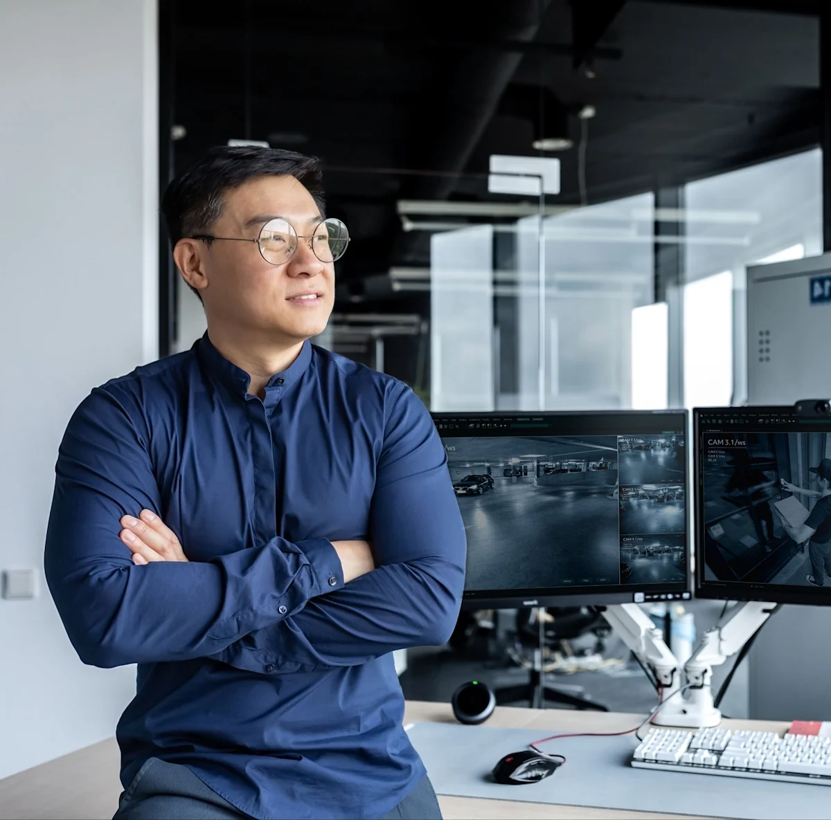 Property Manager watching security monitors