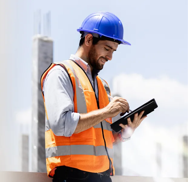 Construction Worker looking at a digital tablet