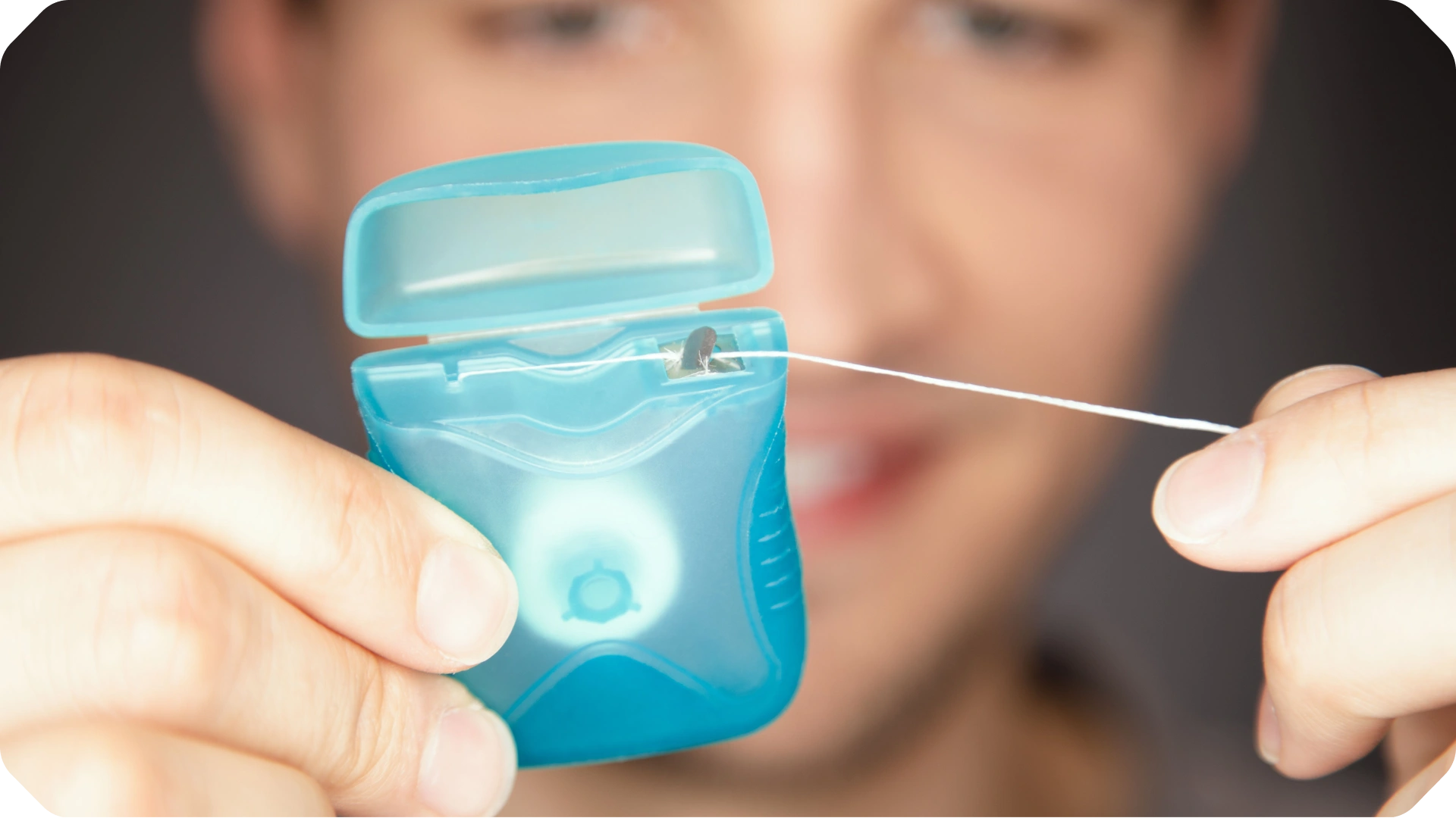 Step 2: Floss: Image highlighting flossing wire, demonstrating our product