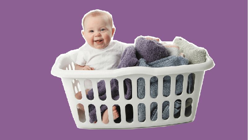 baby in hamper parenting hacks-separate by colors