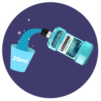 Pouring two tablespoons of Listerine Antiseptic mouthwash into a cup