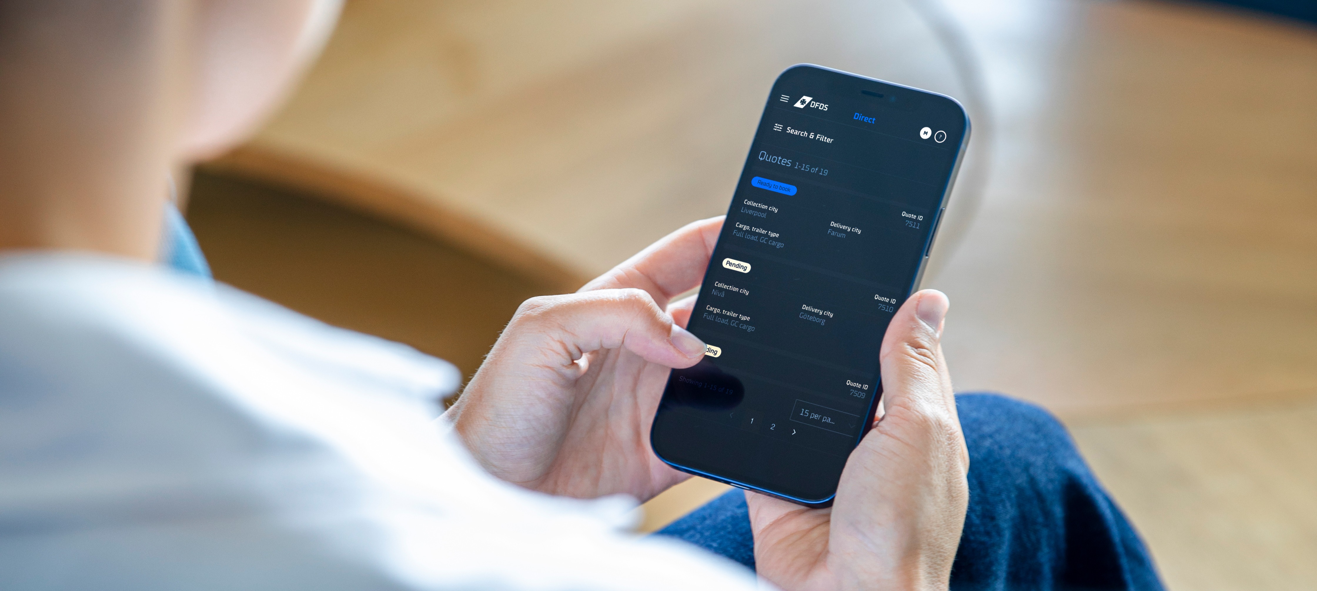 A customer using the DFDS app on their smartphone to create a booking.