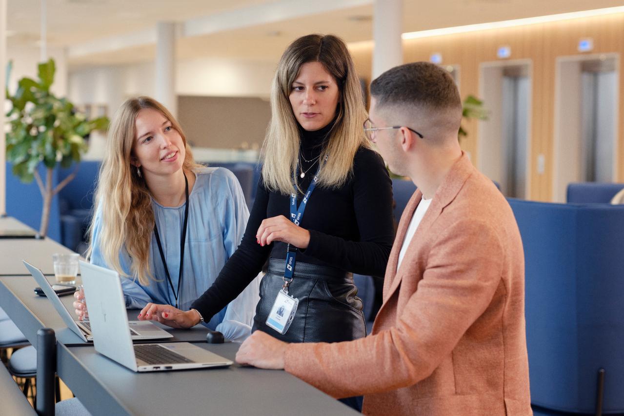 Colleagues working together in an office.
