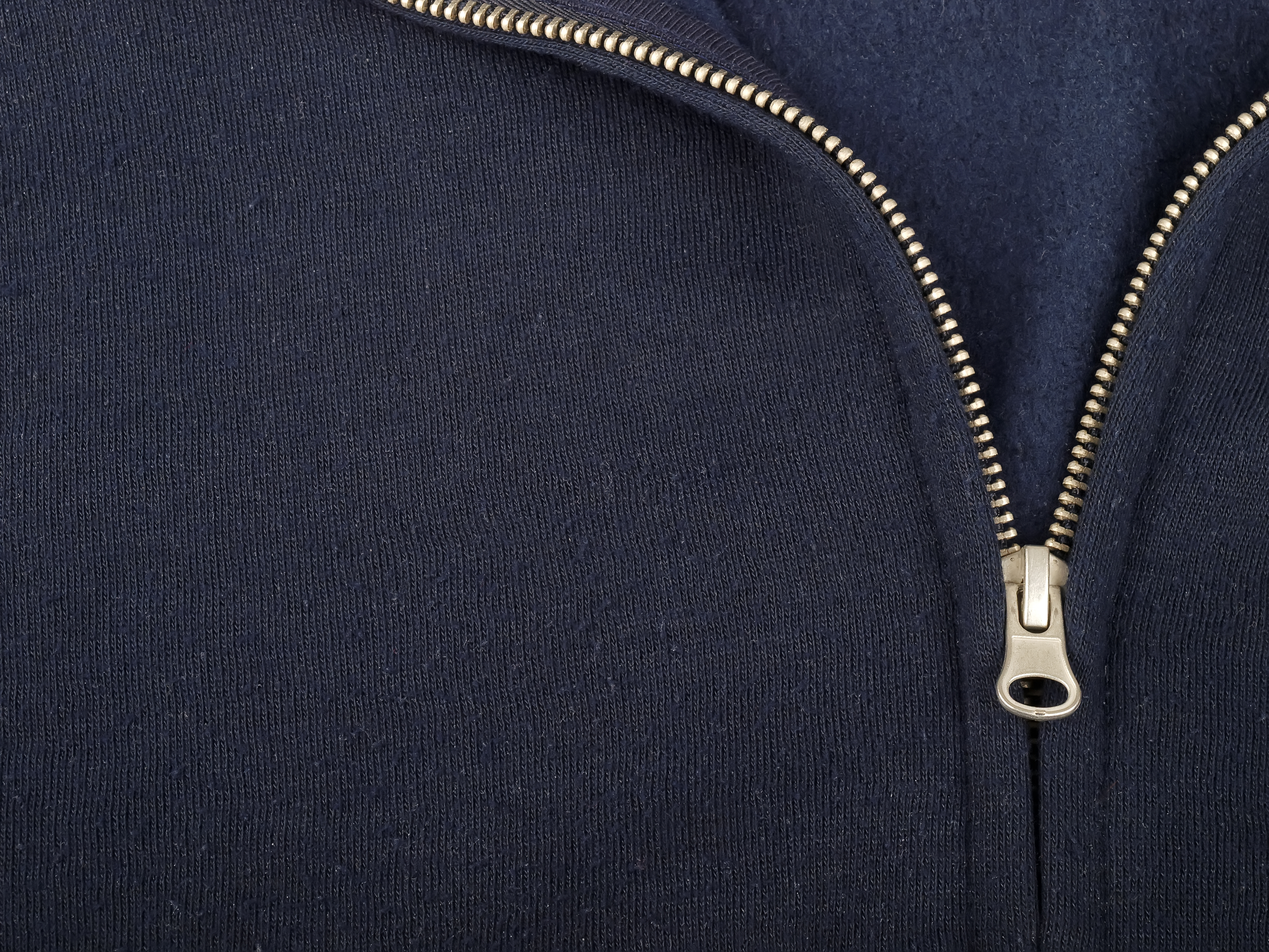 Close-up of a navy garment with a repaired zipper