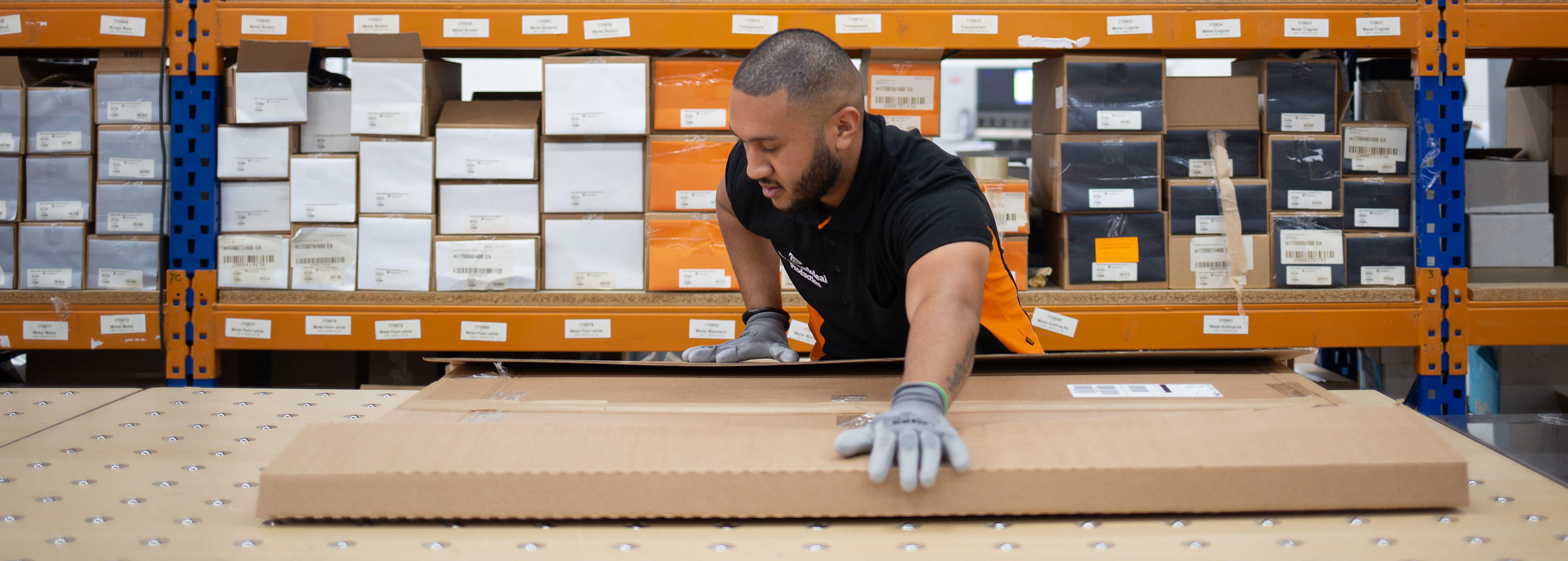 Print warehouse with personnel and a large printer
