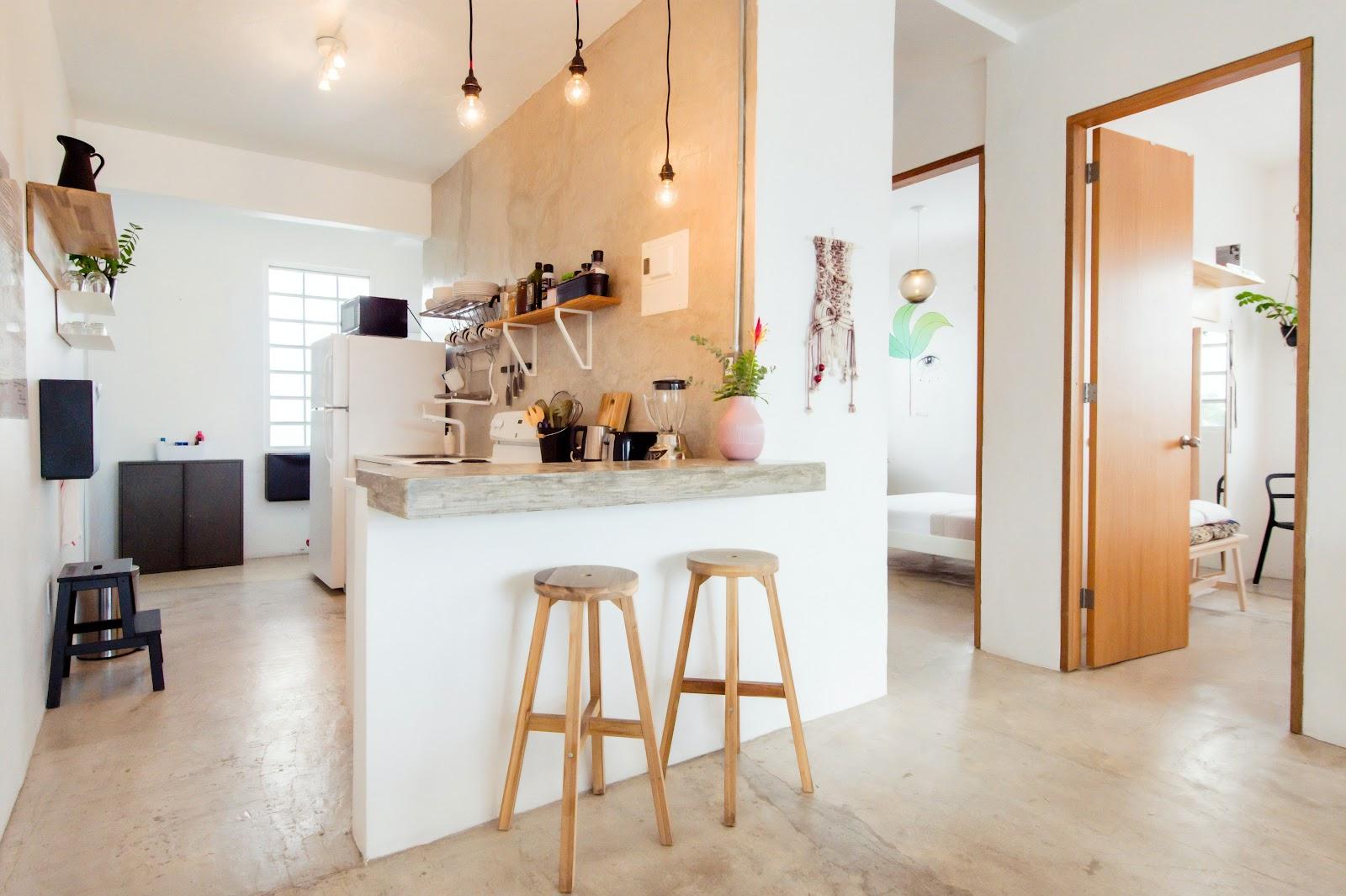 The kitchen and breakfast bar of an apartment at Tropicalia by DW in Ocean Park, San Juan.