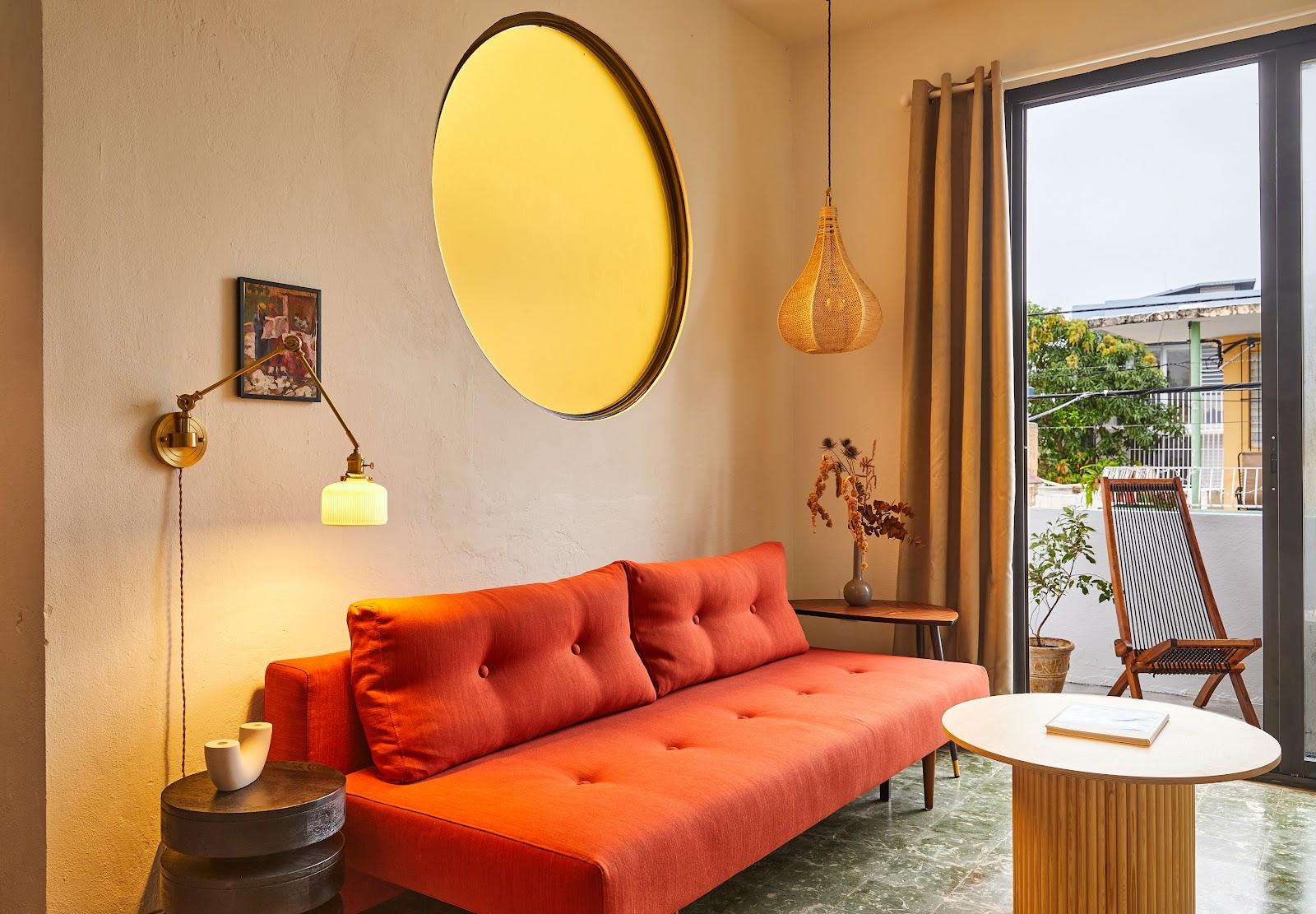A living room with a terrace door at APT by DW in Santurce, San Juan.