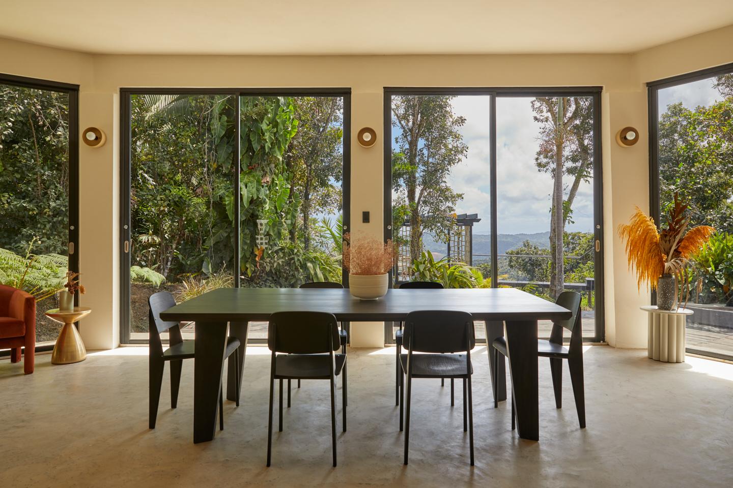 The dining room at Selva by DW, with floor-to-ceiling windows onto the rainforest near Luquillo.