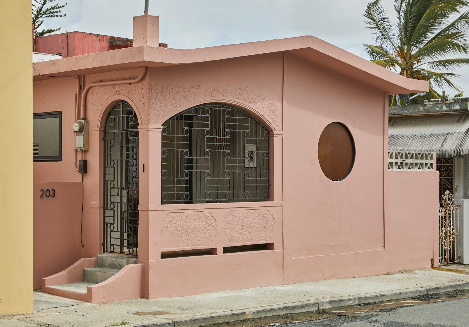 The pink street frontage of Rosa by DW, a Dreamers Welcome loft stay in Santurce, San Juan.