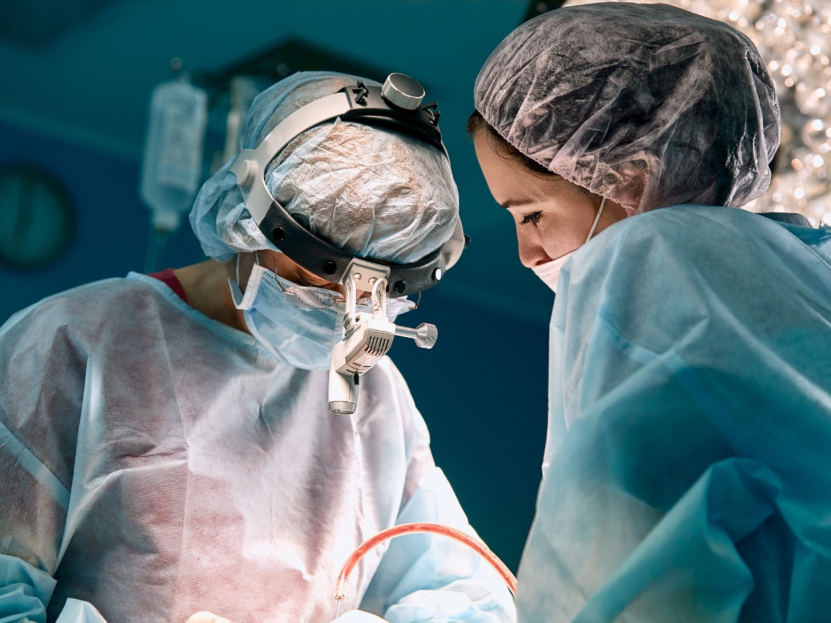 closeup-shot-in-the-operating-room-assistant-hands-out-instruments-to-picture-id1251648454