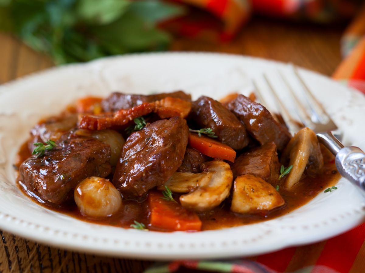 closeup-of-beef-bourguignon-served-on-white-plate-picture-id178221152