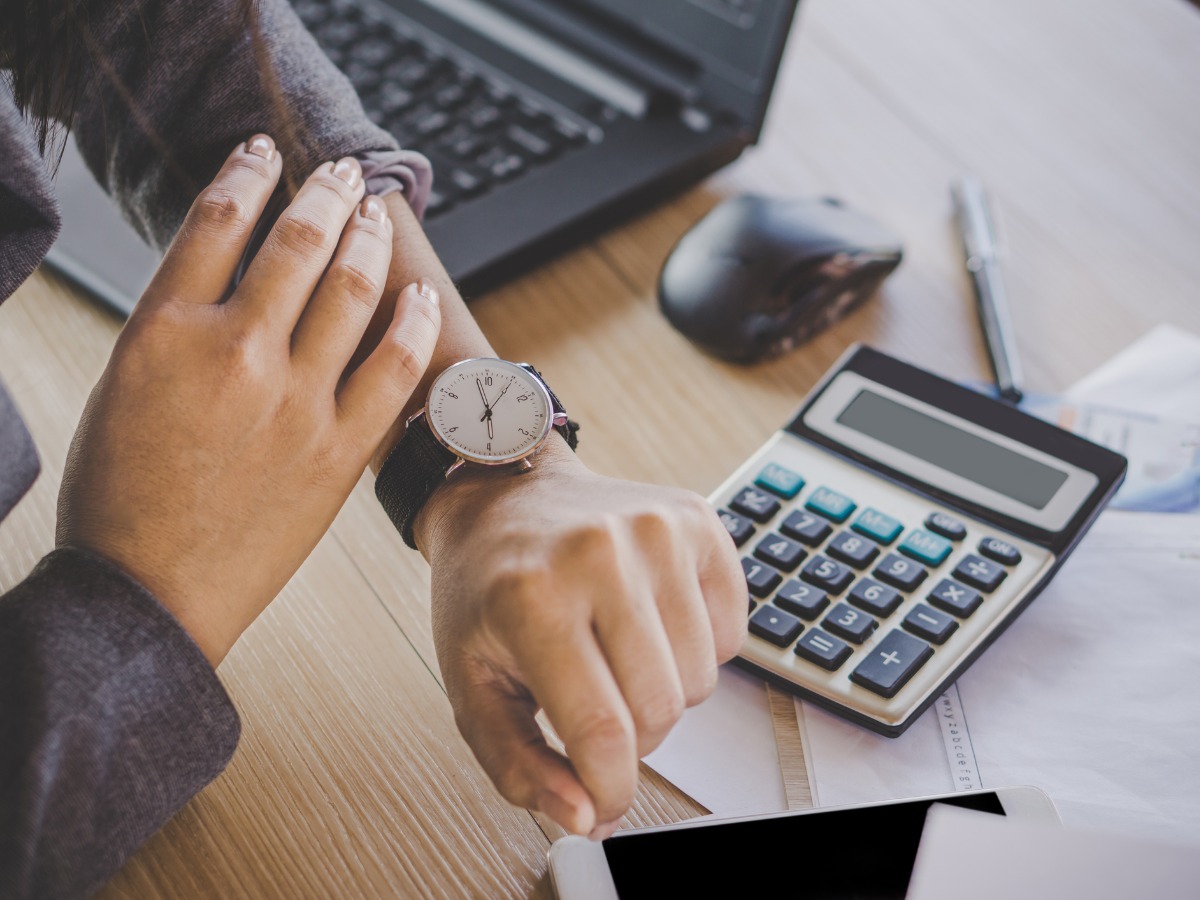 businesswoman-checking-the-time-on-watch-picture-id962240924