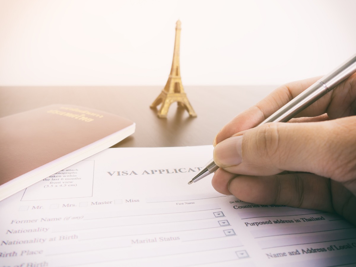 filling-visa-application-form-for-france-paris-picture-id651496416