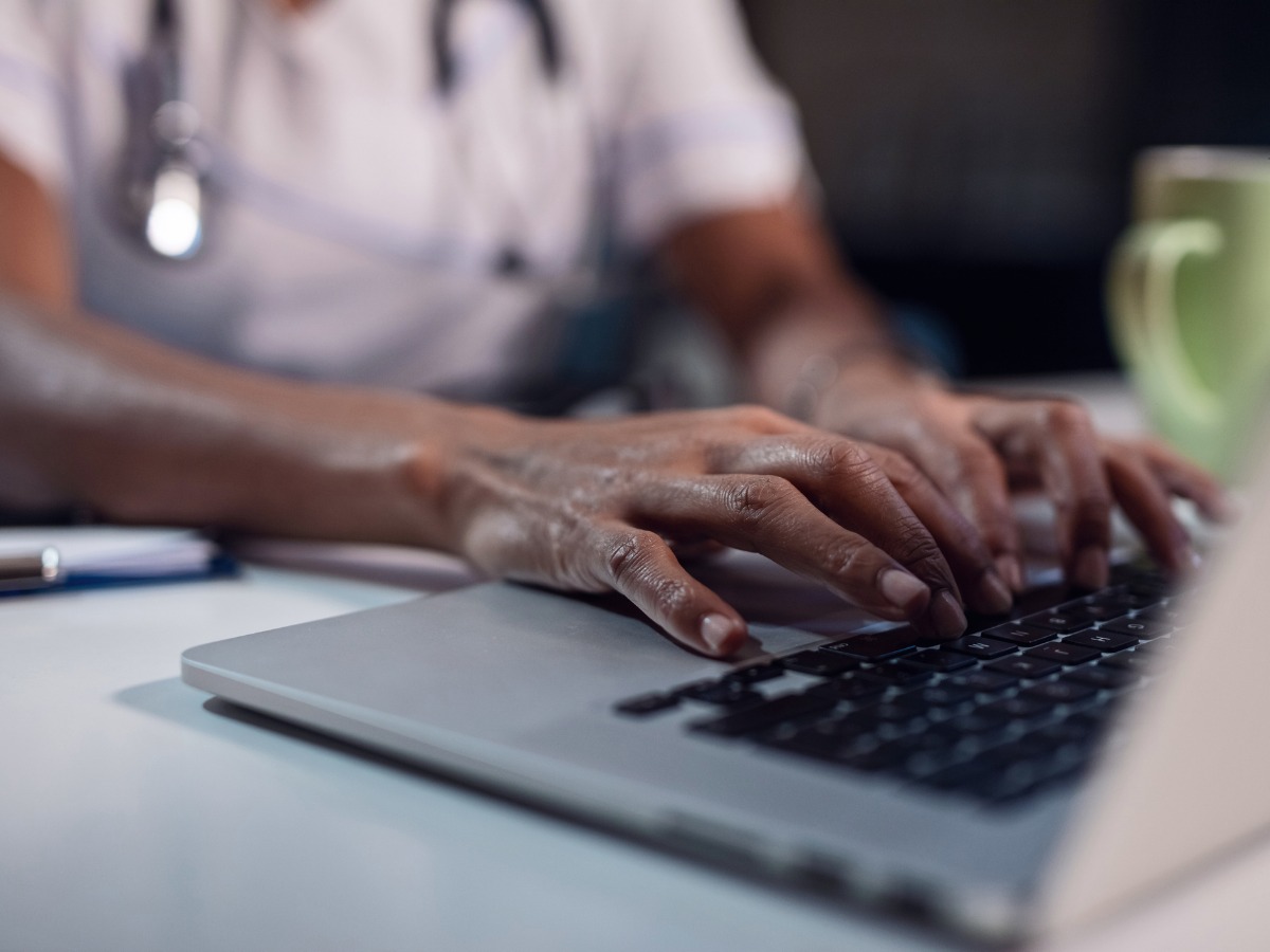 close-up-of-black-female-doctor-using-laptop-picture-id1133533550