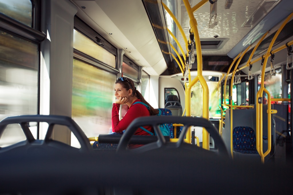 pretty-young-woman-on-a-streetcar-autobus-during-her-commute-picture-id504884512