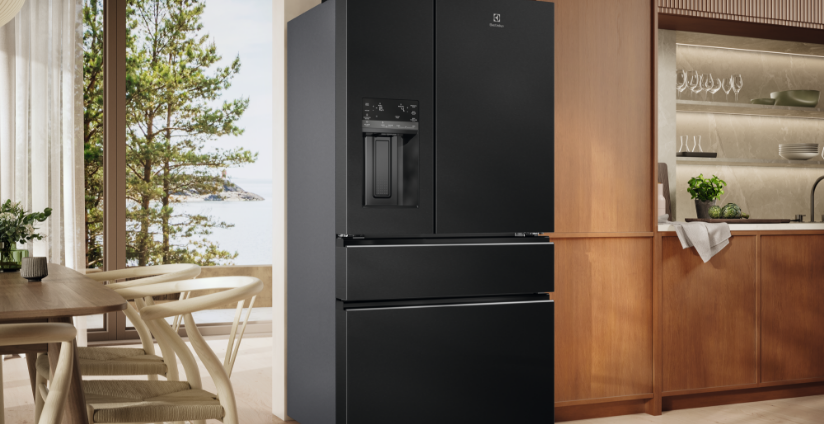 Black Electrolux French door fridge in a modern timber kitchen