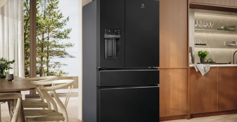 Black Electrolux French door fridge in a modern timber kitchen