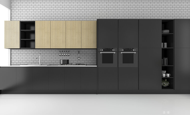 A black kitchen with integrated appliances