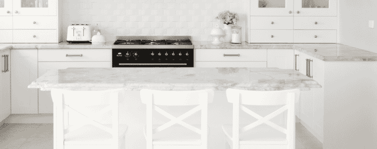 A white kitchen island in a Hamptons style kitchen