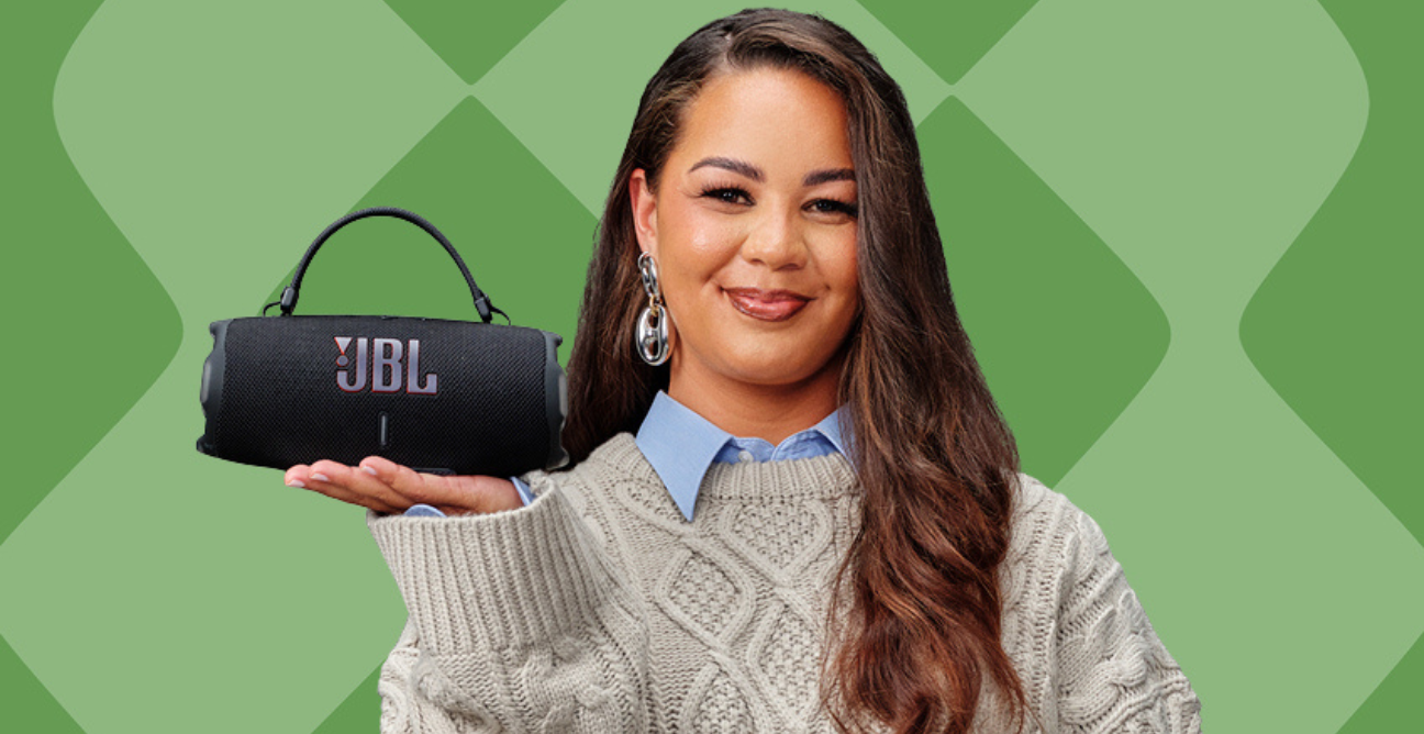 woman poses over JBL charge 5