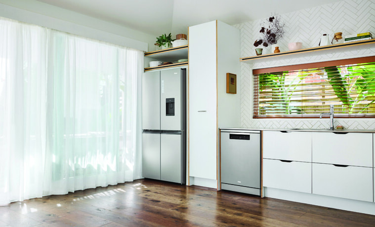 The Haier Dishwasher Satina matches a Haier fridge in a white kitchen