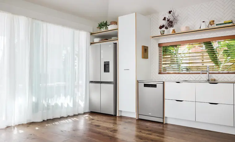 The Haier Dishwasher Satina matches a Haier fridge in a white kitchen