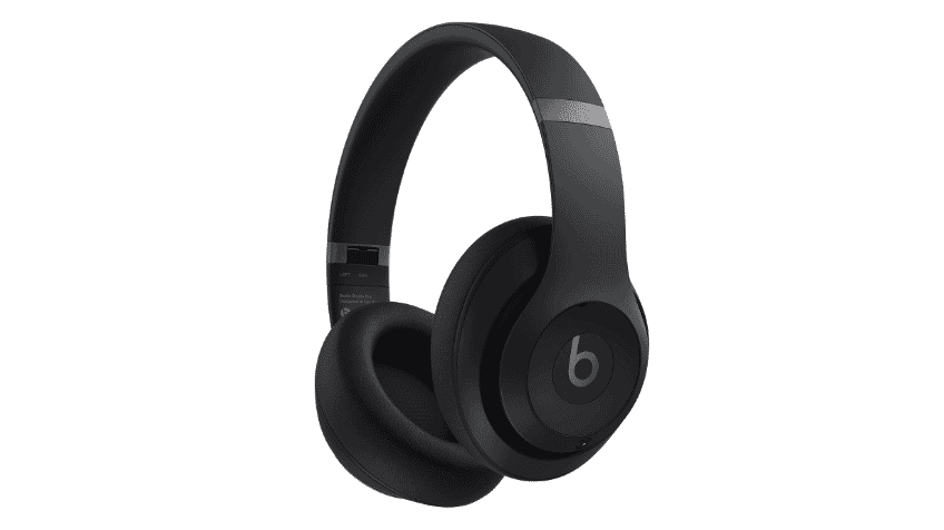 Man wearing Black Beats Studio Pro Headphones whilst walking on the street  The Good Guys