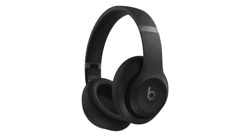 Man wearing Black Beats Studio Pro Headphones whilst walking on the street The Good Guys