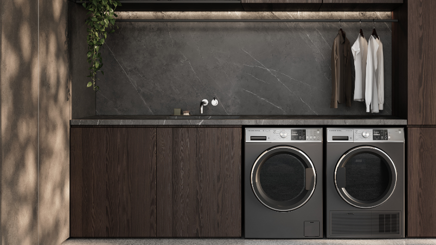Lifestyle image of Fisher  Paykels front load washing machine and heat pump dryer side by side in a modern laundry