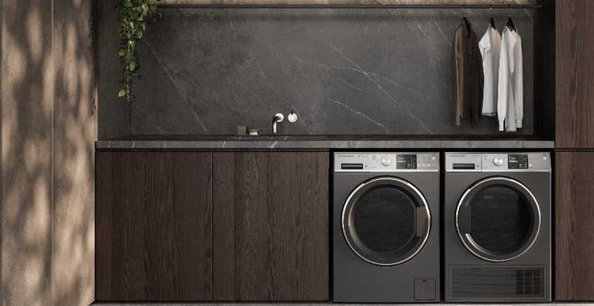 Lifestyle image of Fisher  Paykels front load washing machine and heat pump dryer side by side in a modern laundry