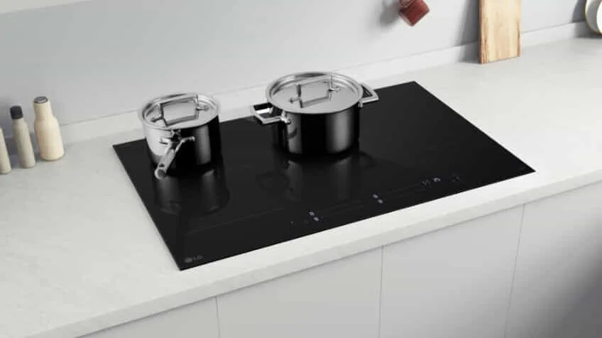 Lifestyle image of pots and pans cooking on an LG induction cooktop