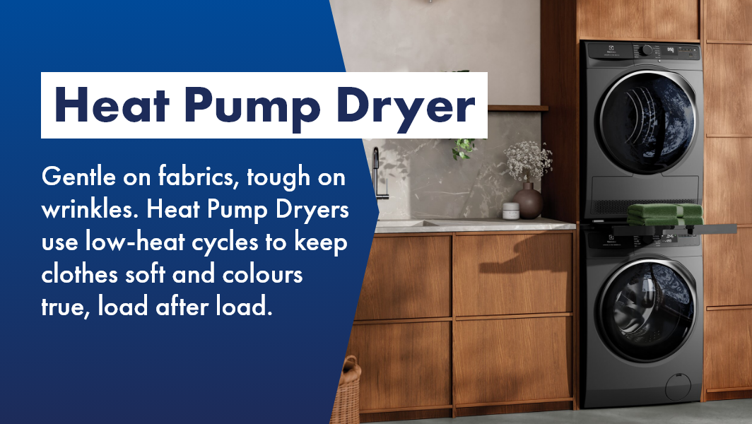 Heat pump dryer stacked on washer in stylish laundry.