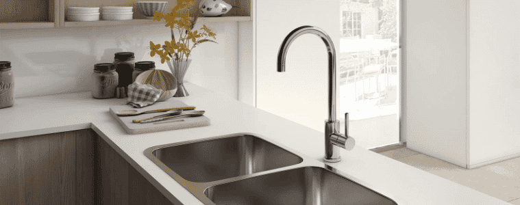 A chrome sink and tap in a Hamptons style kitchen