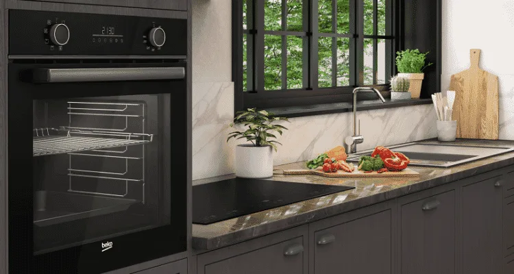 Beko built-in oven surrounded by darker cabinetry and a darker coloured benchtop.