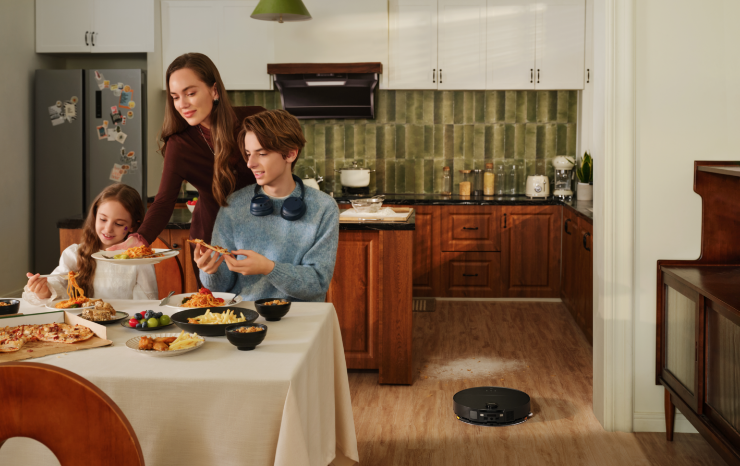 Roborock vacuum vacuuming kitchen floor. 