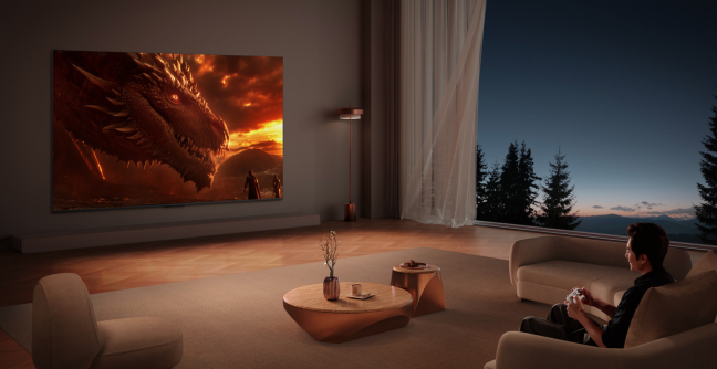 Image of a man gaming on a TCL C8L TV