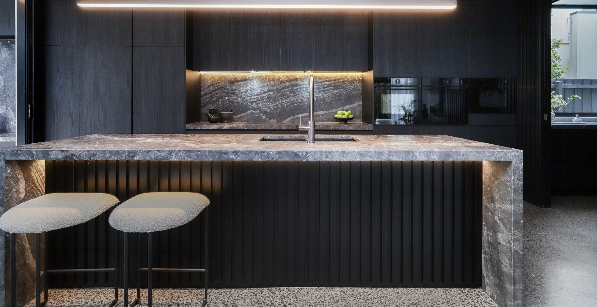 Black and moody kitchen with Bosch appliances. 