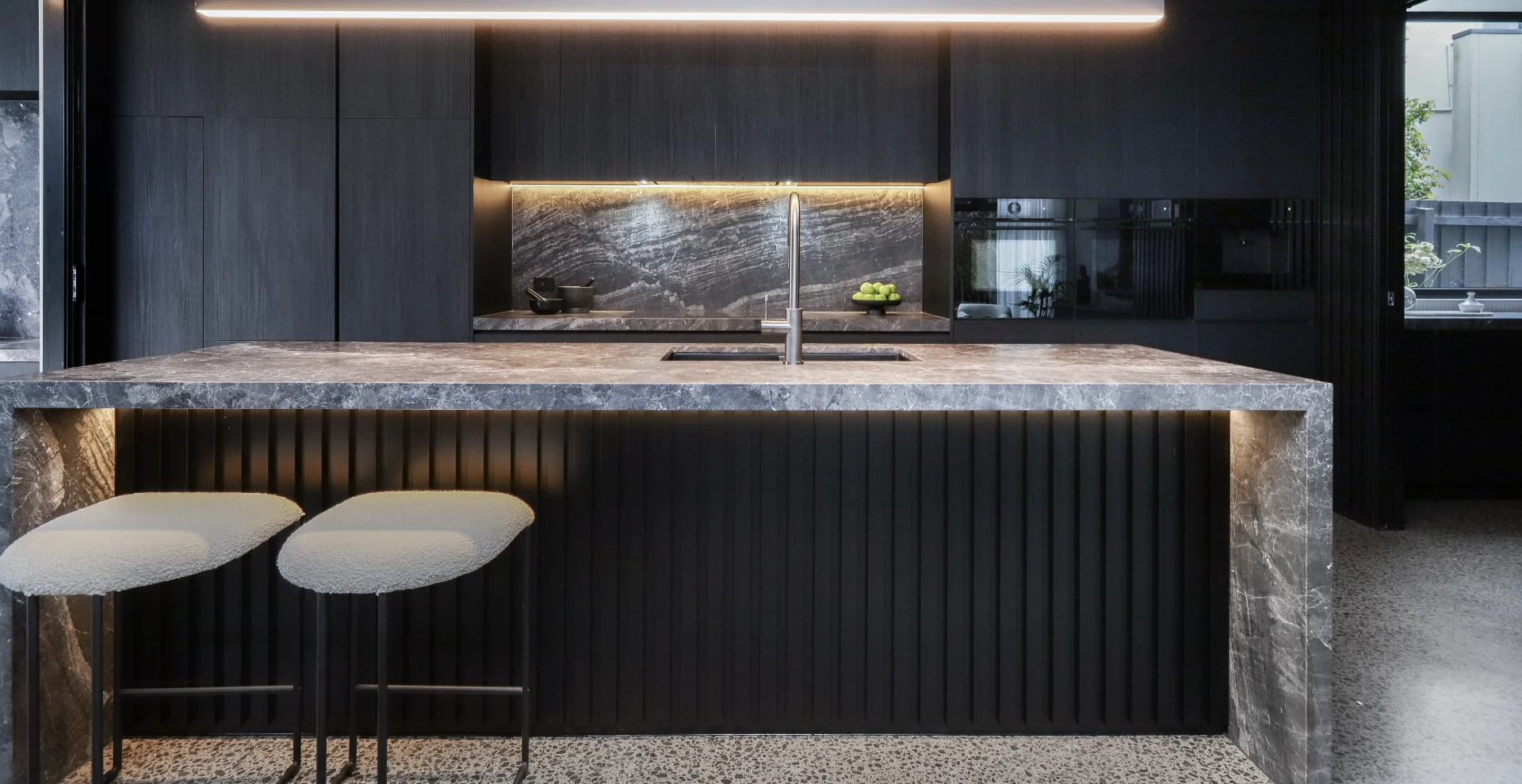 Black and moody kitchen with Bosch appliances.