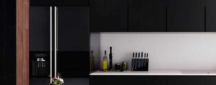 Side by side black fridge with stainless steel handles in a luxury apartment kitchen